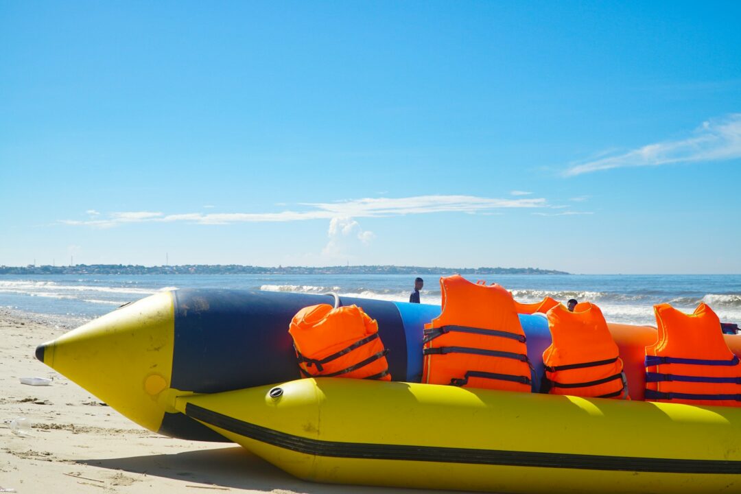 A banana boat on a beach, waiting for riders.