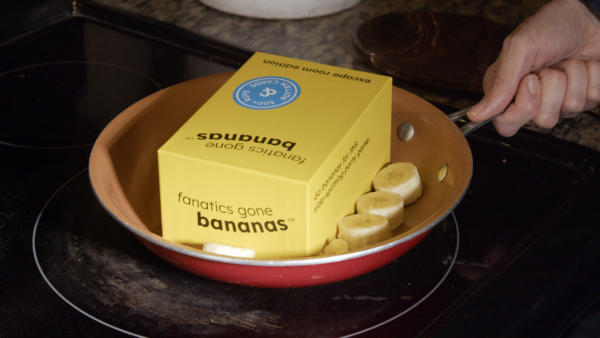 A photo of a Fanatics Gone Bananas box being pan fried along with some banana slices.