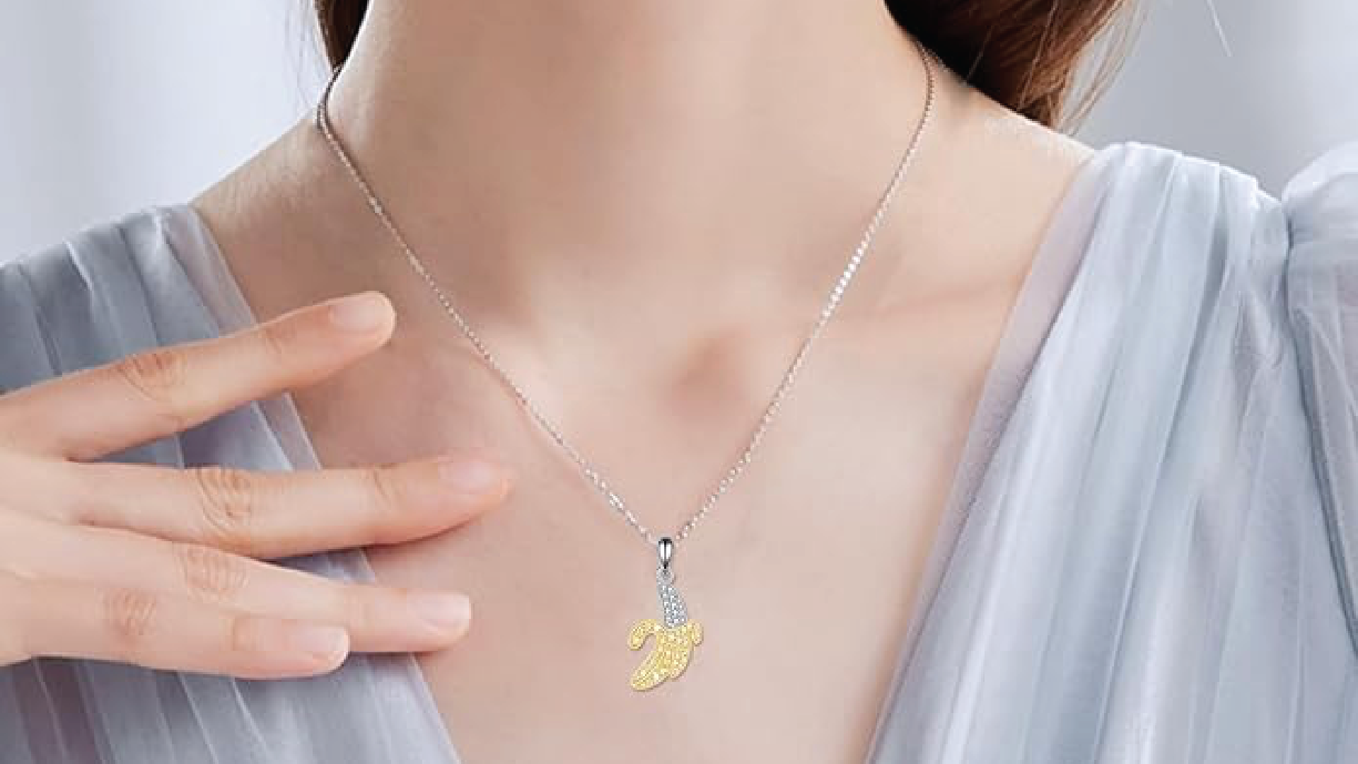 A banana necklace worn by a classy lady.