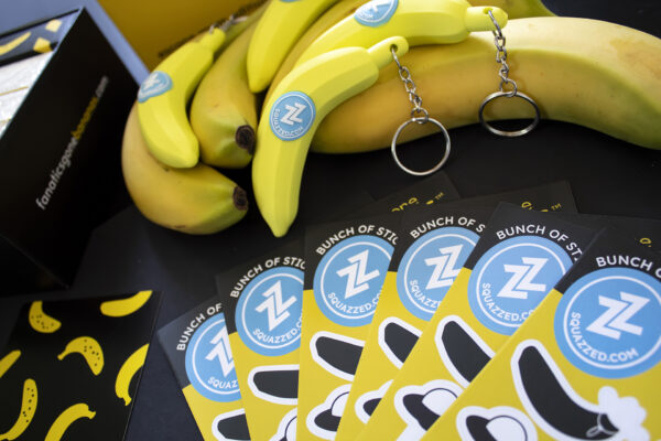 A picture with a combination of banana products, including Fanatics Gone Bananas, stickers, and keychains.
