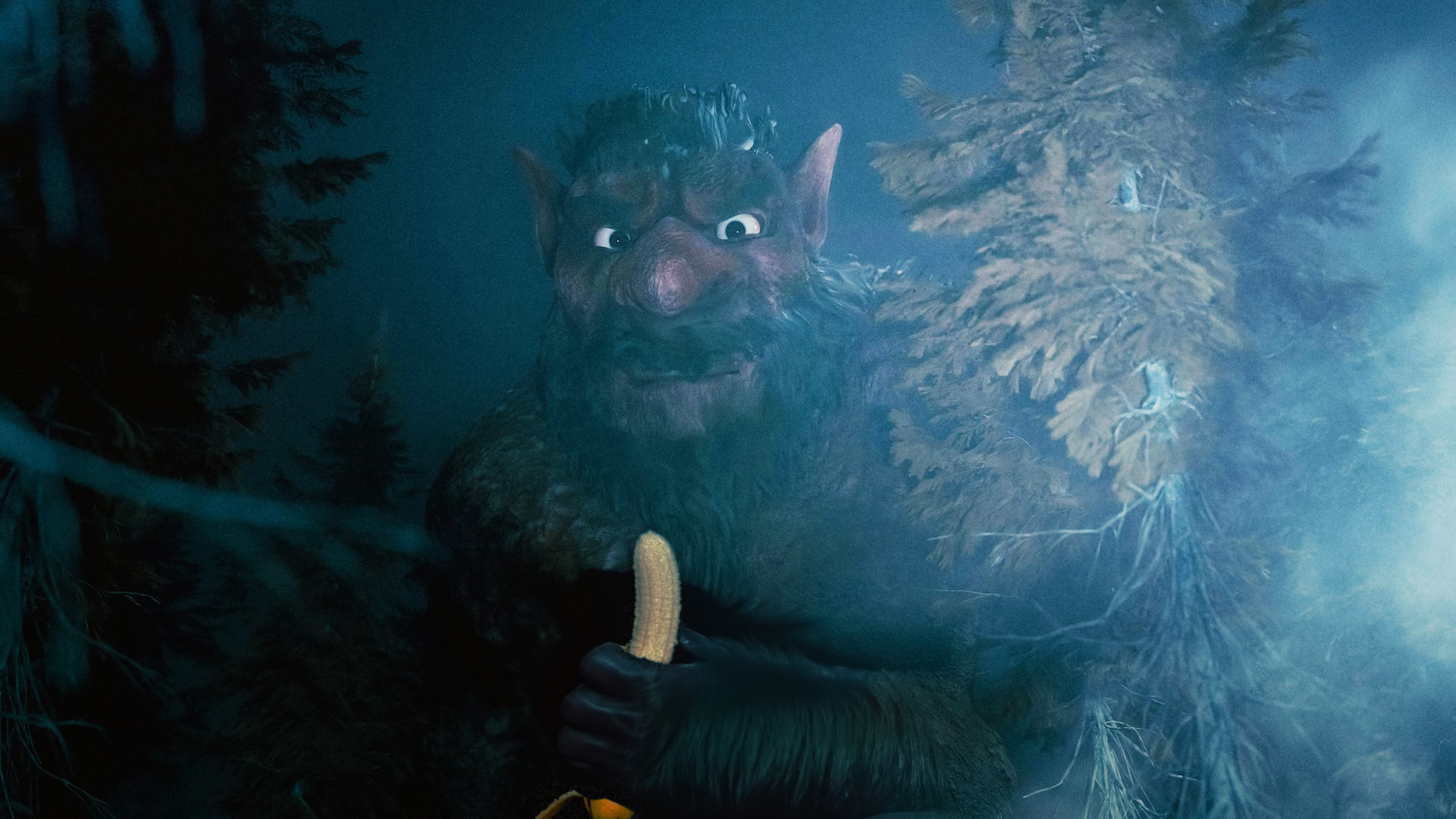 A troll grasps a banana in a dark and shadowy location.