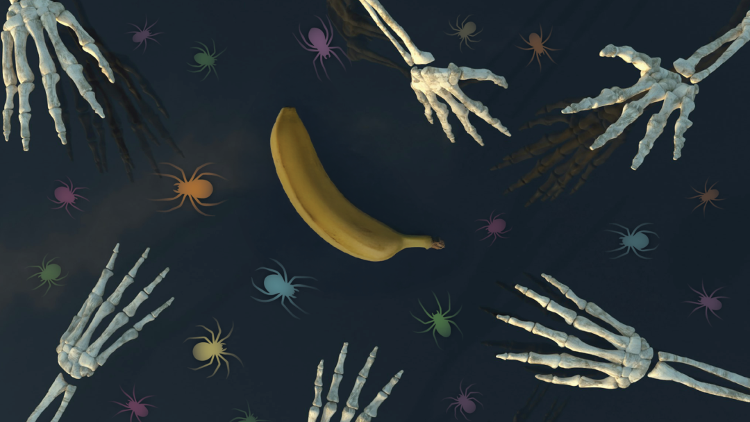 Skeleton hands reach out for a banana.